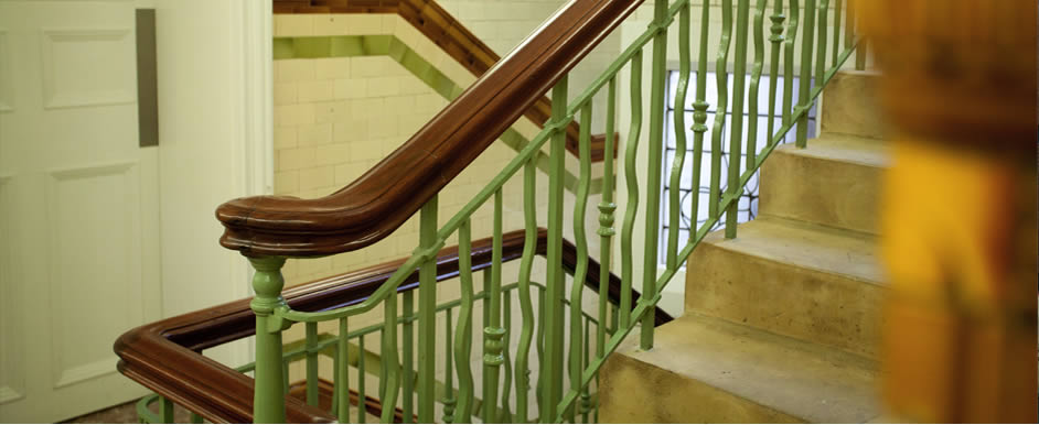An elegant stone staircase sweeps through the centre of the building