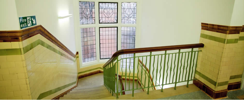 An elegant stone staircase sweeps through the centre of the building