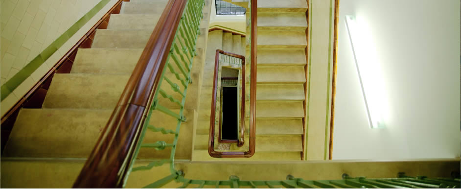 An elegant stone staircase sweeps through the centre of the building